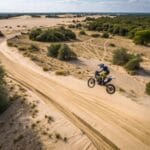 action-motorbike-jumping-on-an-sandy-track-view-from-a-dr